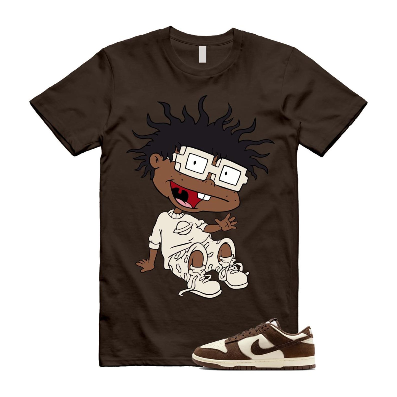 Brown t-shirt with cartoon-style character graphic designed to match the Dunk Baroque Brown Pale Ivory sneakers, sneaker matching outfit concept.